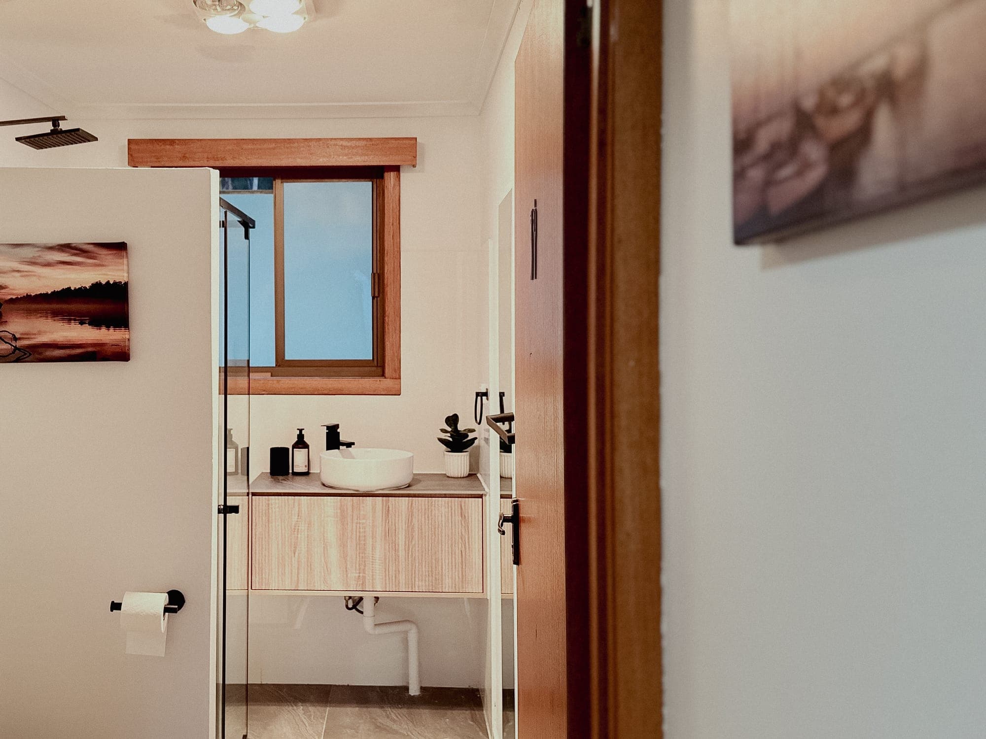 LunaStay — bathroom with glass walk-in shower