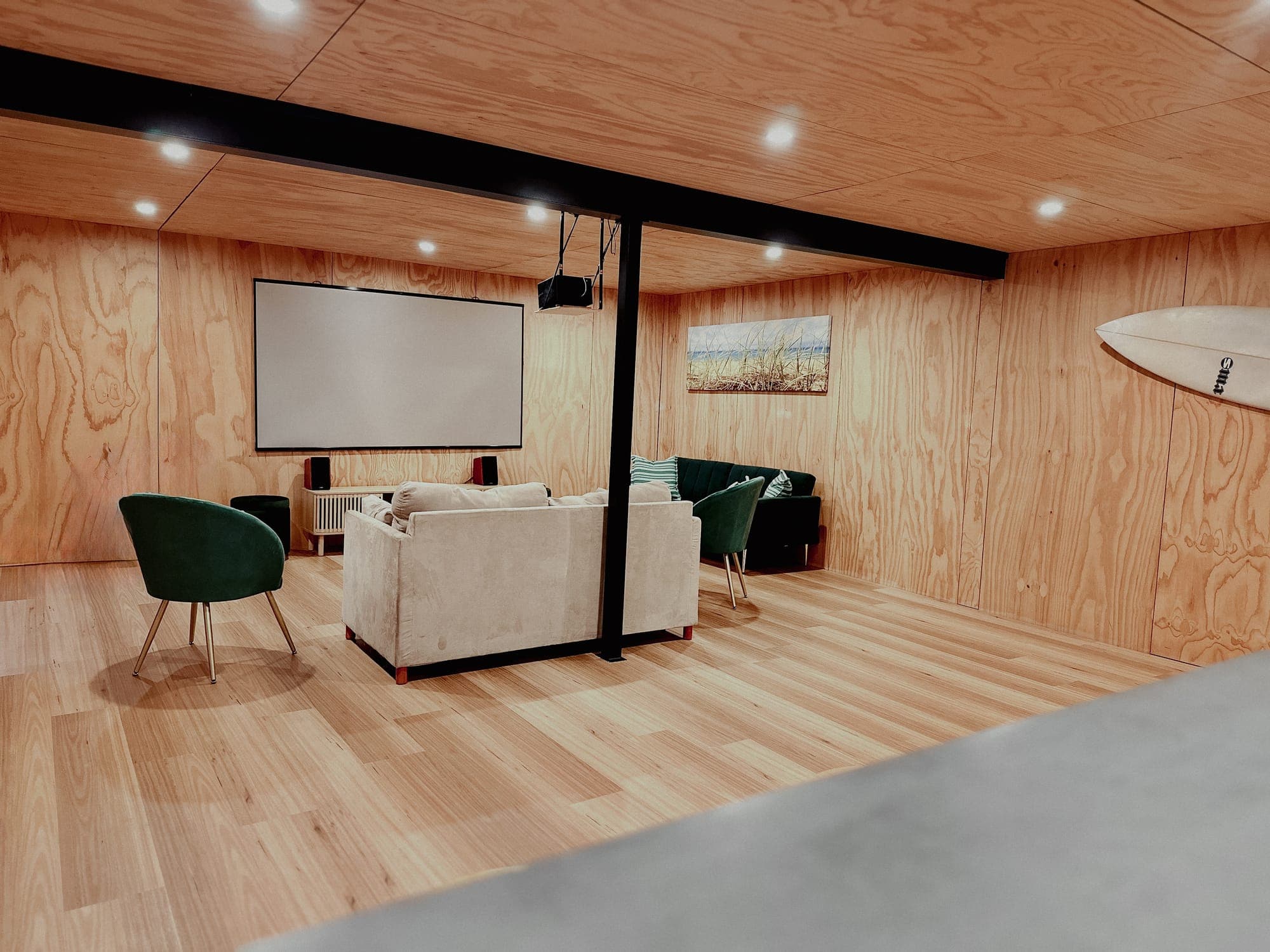 LunaStay — cinema room lounges facing the projection screen