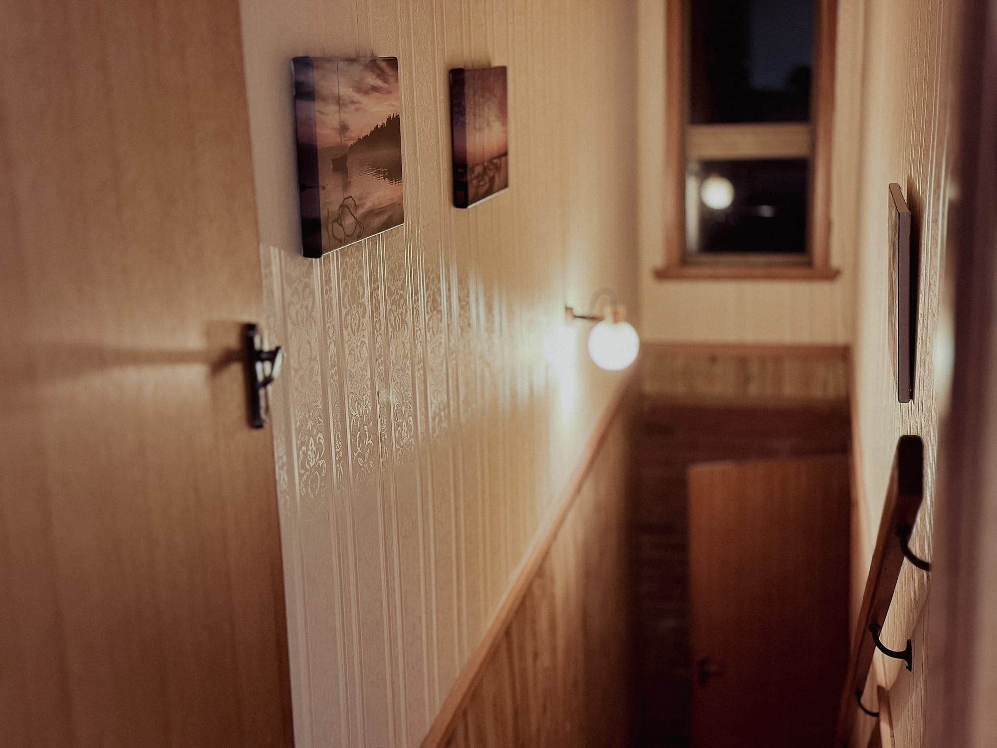 LunaStay — hallway leading down to the cinema room